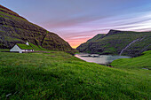 Europe, Denmark, Faroe Islands, Streymoy, Saksun: the sun sets over the fjord