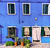 Burano, typical colored houses, blue house; Burano, Venice, Veneto, Italy, south Europe.