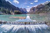 Europe, Italy, Trentino, Dolomites: morning reflections on the Dobbiaco Lake