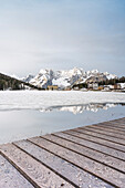 Europe, Italy, Veneto, Dolomites: sunrise reflections on a icy and snowy Misurina Lake