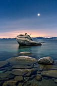 USA, Nevada, Lake Tahoe: moon rising over Bonsai Rock