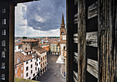 ancient window of the the astronomical clock tower in the morning with Andrea Mantegna square, bell tower of S.Andrea Basilica Mantua, Lombardia, north Italy, south Europe