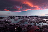 Midnight Sun and Crazy Sky at Jökulsárlón, Diamond beach, Austurland, Iceland, Northern Europe