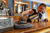 Barman at the chateau albert hotel built in  1907, historic acadian village, bertrand, new brunswick, canada, north america
