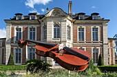 Cello in front of the music and dance school in the town of lisieux, calvados, normandy, france