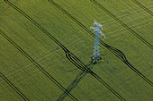Pylon for high-voltage power lines in the middle of the fields of grain, eure, normandy, france