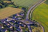 Traffic cirsle in the countryside with a residential housing estate, eure, normandy, france
