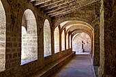 Cloister of the gellone abbey, 9th century romanesque benedictine  abbey, saint-guilhem-le-desert, classed as one of the most beautiful villages of france, herault, occitanie, france