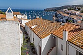 Village with red tile roofs and sea view, cadaques, costa brava, catalonia, spain