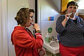 Residents at the tooth brushing with songs workshop, sessad la rencontre, day care, support and service organization for people with disabilities, le neubourg, eure, normandy, france