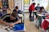 Pupils at the junior high school, adapted classroom, ime la riviere for children, teenagers and young adults, nassandres-sur-risle, eure, eure, normandy, france