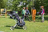 Maintenance of the golf pastoral de la charentonne golf course, natura 2000 class, workers with the esat les ateliers du coudray, adapei27, bernay, eure, normandy, france