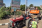 Building equipment, street scene by the canal, nile valley, al masid, luxor, egypt, africa