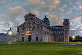 Famous Pisa Cathedral or Duomo and leaning tower lit by sunrise, Piazza Dei Miracoli, Pisa, Tuscany, Italy