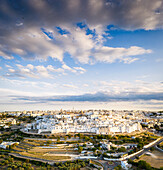 Aerial panoramic of the white town of Ostuni at sunset, province of Brindisi, Salento, Apulia, Italy