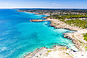 Aerial view of cliffs overlooking the turquoise sea, Torre Lapillo, Porto Cesareo, Lecce province, Salento, Apulia, Italy