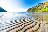 Sunny day over Ersfjord beach and mountains in summer, Senja, Troms county, Norway