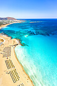 Aerial view of the equipped beach of Falassarna washed by the turquoise sea, Kissamos, Chania, Crete island, Greece