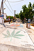 Street paintings on flooring of the streets in the village of Matala, Crete island, Greece