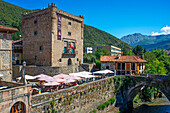 Potes village hanging old buildings over the Rio Quiviesa, Potes, Picos de Europa Cantabria, Spain