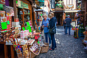 Souvenirs and handicrafts in Potes village hanging old buildings over the Rio Quiviesa, Potes, Picos de Europa Cantabria, Spain