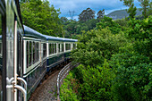 Outisde carriages of Transcantabrico Gran Lujo luxury train travellong across northern Spain, Europe. Journey between Unquera and Cabezon de la Sal.