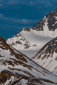 Snow streaked mountain peaks above Magdalenefjorden. Magdalenefjorden, Spitsbergen Island, Svalbard, Norway.