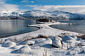 A scenic snowy fjord near Lodingen. Lodingen, Lofoten Islands, Nordland, Norway.
