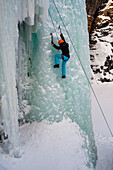 Ice climbing on a frozen waterfall in Abisko National Park, Sweden. MR