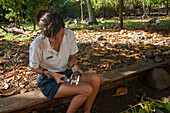 A conservationist measuring an Aldabra tortoise, Dipsochelys dussumieri. Fregate Island, The Republic of the Seychelles.
