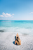 A girl enjoing Stintino La Pelosa beach. Stintino, Sassari province, Sardegna, Italy