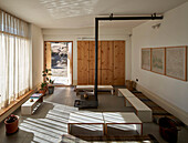 Living room with wooden cabinets and wood-burning stove