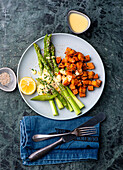 Roasted sweet potatoes with green asparagus
