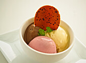 Sundae with chocolate, vanilla and strawberry ice cream
