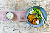 Carrot and pumpkin fritters with a side salad