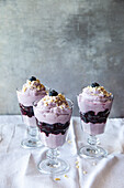 Blueberry and cream dessert with almonds