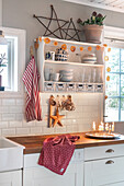 Country-style kitchen with open shelves and decorations