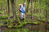 Scientist goes out to collect samples from swamp