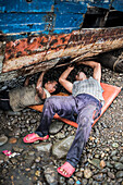 Repairing old fishing boats near Iboih, Pulau Weh Island, Aceh Province, Sumatra, Indonesia