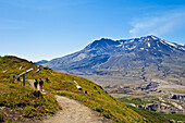 Two women hiking on Boundary Trail near Johnston Ridge Visitor Center; Mount Saint Helens National Volcanic Monument, Washington.