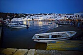 Fishing boats at night in Mykonos town, Greece