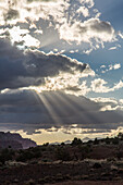 Sun rays through the clouds over Capitol Reef National Park in Utah.