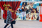 An actress walks down the outside of the Lincoln Center Theater. Lincoln Center, 150 West 65th Street, New York, USA.