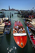 Boats and gondolas in the canals of Venice, Italy
