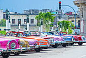 Old classic American cars on one of Havana's Cuba streets. There is nearly 60,000 vintage American cars in Cuba