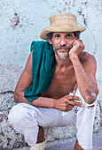 A portrait of a Cuban man in old Havana street. The historic center of Havana is UNESCO World Heritage Site since 1982.