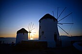 Traditional windmills (Kato Milli) at sunset in Mykonos town, Greece