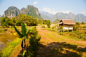 Bamboo Hut Accommodation and Mountain Scenery at Vang Vieng, Laos
