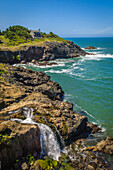 Waterfall and Rocky Creek cove on the Otter Crest Scenic Loop; central Oregon Coast.