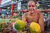 Woman fruit seller at Papeete Municipal covered Market, Papeete, Tahiti, French Polynesia, Tahiti Nui, Society Islands, French Polynesia, South Pacific.